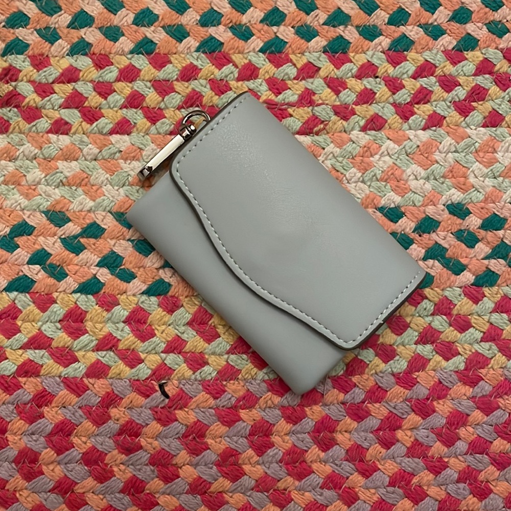 This wallet is light blue and never used